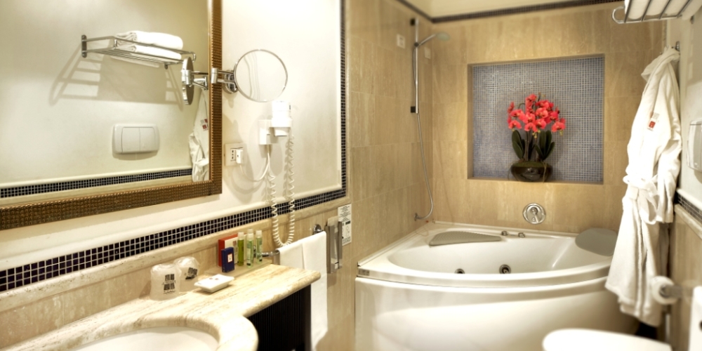 inside the bathroom with jacuzzi